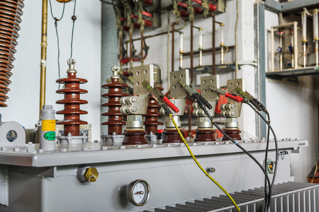 Three phase oil immersed transformer under induced over voltage test, focusing on LV terminals which...