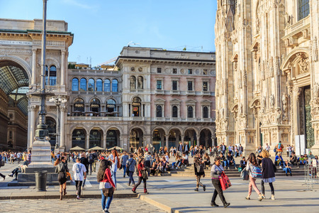 MILAN, ITALY - 17 APRIL 2018 - Crowd of people come to walk, sit down and relax at the piazza in front of Duomo di Milano in the eveningのeditorial素材