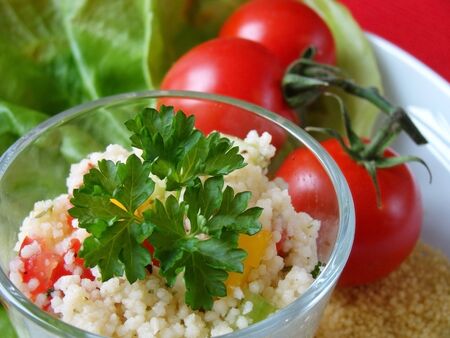 Close up of a traditional Arabian dish: Tabouleh salad with couscous, tomatoes and parsley.の写真素材