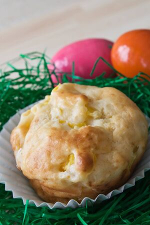 Selective focus image of a mango muffin with Easter decoration