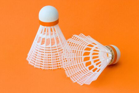 Close-up image of badminton balls with orange background.の写真素材