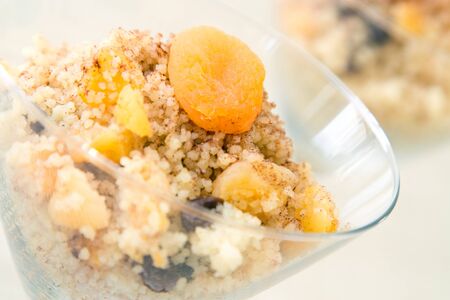 "Seffa de Couscous", a traditional sweet dish from Algeria and Morocco made with cinnamon and dried fruits like raisins and apricots.の写真素材