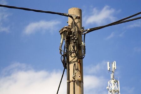 Telephone pole with blue sky.の写真素材
