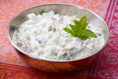 Oriental yoghurt from cucumber, raisins and mint which you often find on a traditional meze buffet.の写真素材