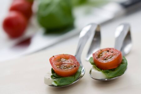 Starter with tomato mozzarella with basil.の写真素材