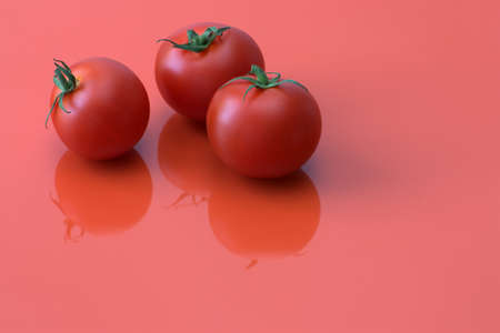 Close-up image of red tomatoes with orange background.の写真素材