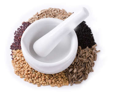 Isolated mortar with the ingredients for Panch Phoron which is an Indian spice blend and which is made in equal measure from fennel seed, cumin seed, mustard seed, fenugreek and black cumin.の写真素材