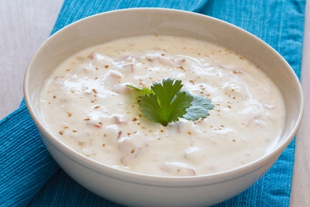 Indian yogurt dip with tomatoes and cilantro which is also called raita.の写真素材