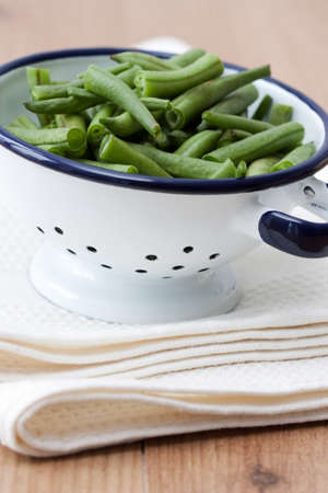 Image of fresh sliced green beans in an old bowl in country house style.の写真素材