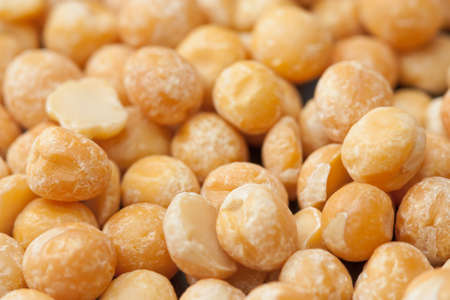 Full frame image of dried yellow peas with selective focus.の写真素材