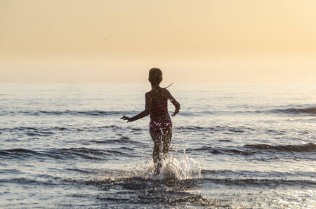 Run into the seaの写真素材