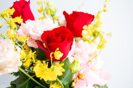Bouquet of flowers in vase on white background, stock photoの写真素材