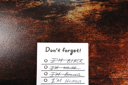 Message I'm human don't forget on wood desk i'm not black I'm not white