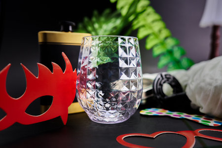whiskey glass with flask on a black background metal maze puzzle leaves maskの写真素材