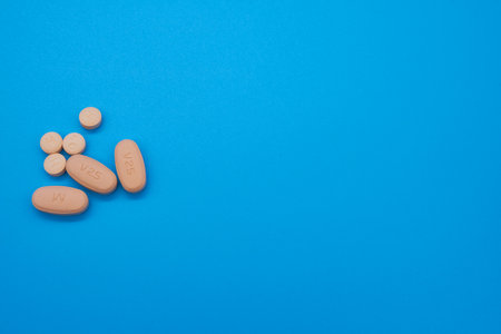 Opioid crisis drugs pills prescription medication light blue background blood pressureの写真素材