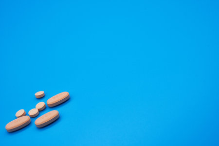 Opioid crisis drugs pills prescription medication light blue background blood pressure