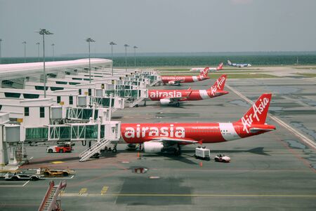 Airplanes of Airasia parking at International airport in Kuala Lumpurのeditorial素材