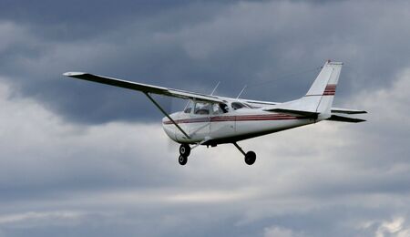 Plane below an incoming stormの写真素材