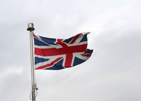 Union Jack against a cloudy skyの写真素材