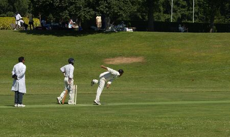 cricket bowler throwing ballの写真素材