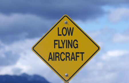 warning sign at the side of the roadの写真素材