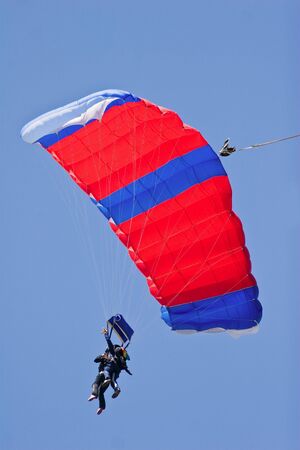 tandem skydivers floating on the windの写真素材