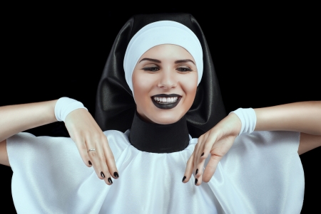 cheerful smiling nun bowed down brushの写真素材