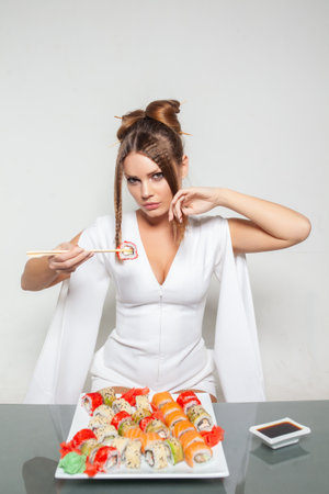 girl eats sushi, delicious sushi, beautiful girlの写真素材