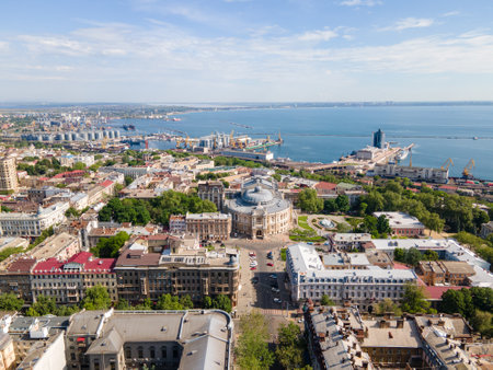 Odesa breathtaking aerial view of a historic coastal city with a grand opera house, lush green...