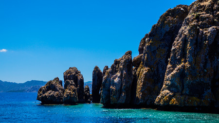 The shore of the Aegean Islands with azure water.の写真素材