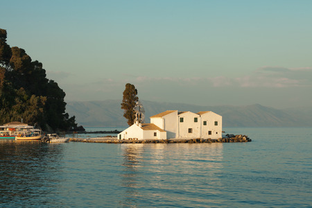 Vlacherna Monastery in Corfu island near Kanoni hill during a sunsetのeditorial素材