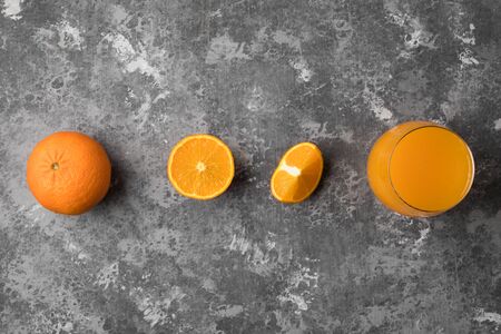 A step by step process of squeezing a fresh orange into healthy juice with a copy spaceの写真素材