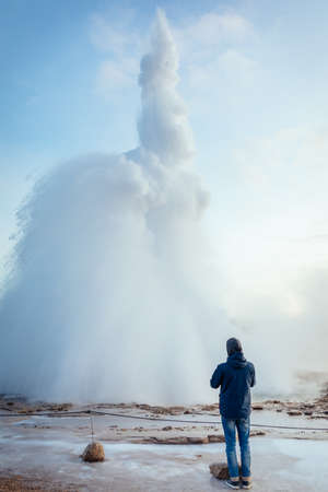 Eruption of Stokkur, a fountain-type geyser in Iceland during winterの写真素材
