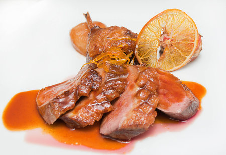  meat orange delicious plate with a tasty orange flavored creamの写真素材