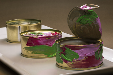 Detail cans of tuna painted in full color. Photographed in studio
