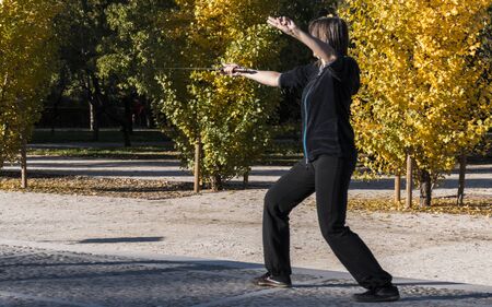 Tai chi with sword in the Retiro park in the city of Madrid. Spainの写真素材