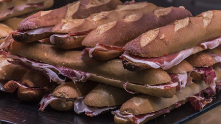 Ham sandwiches one of the tupicos sandwiches in Spain. Photographed in the market of San Miguel, typical market for tapas in the city of Madridの写真素材