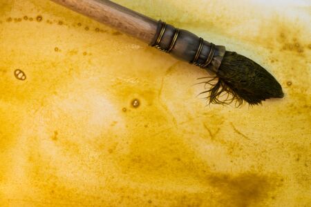 painting with the brush a watercolor yellow abstract background