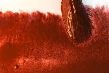 painting with the brush a watercolor sanguine abstract backgroundの写真素材