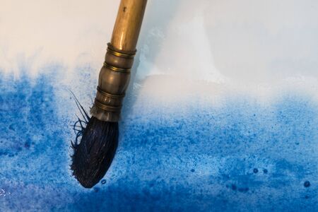 painting with the brush a watercolor blue abstract backgroundの写真素材