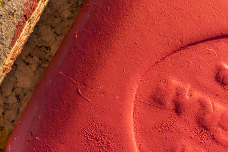 close up of watercolor paint godet used, red