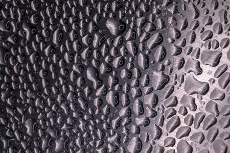 close up of water drops, on an inixidable steel surfaceの写真素材