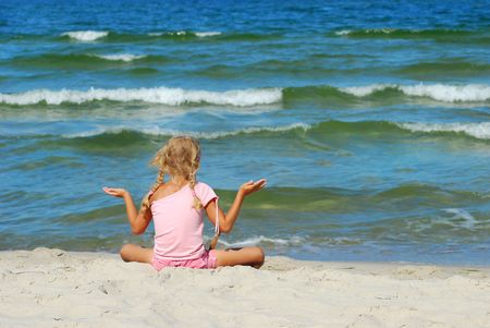 young girl relaxing on a beachの写真素材