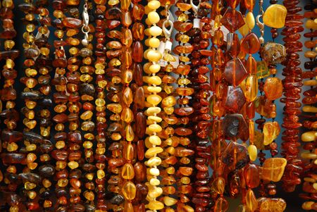 various polish amber necklases hanging at exhibitionの写真素材