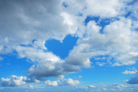 cloudy sky with heart shape blue  holeの写真素材