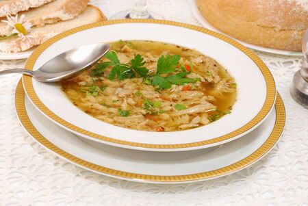 traditional polish tripe soup with vegetables in white plateの写真素材