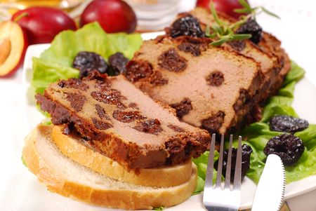 slices of homemade liver and meat pie with prunesの写真素材