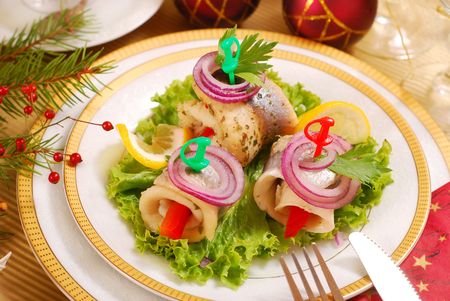 rolled herring fillets with paprika and onion for christmas の写真素材