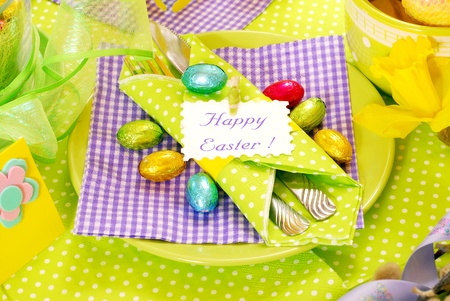 easter table decoration in green,violet and yellow colors