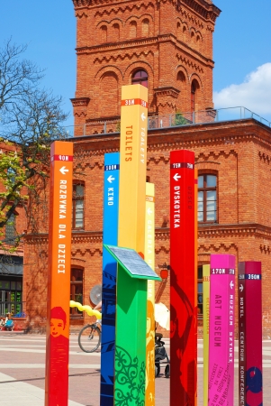 Lodz,Poland-May 19,2012;Colorful information posts in modern part of restored shopping center-Manufactura in Lodzのeditorial素材